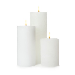 Three alight wax candles on white background