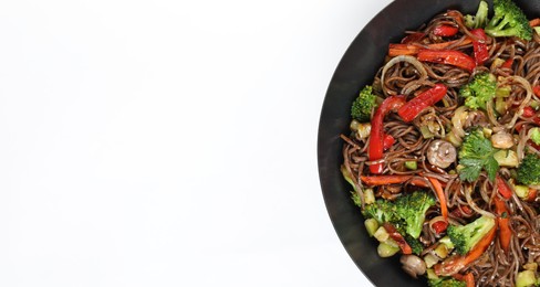 Photo of Stir-fry. Tasty noodles with meat and vegetables in wok on white background, top view. Space for text