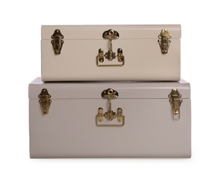 Two stylish storage trunks isolated on white