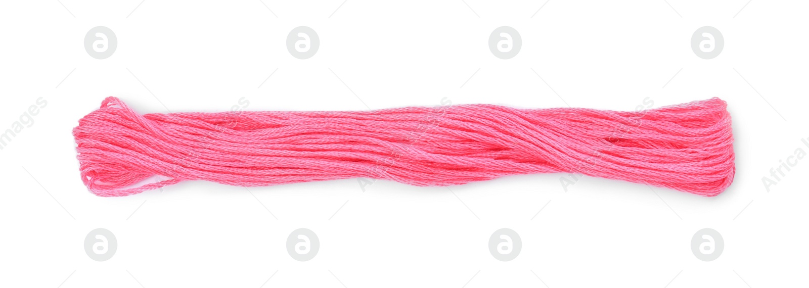 Photo of Bright pink embroidery thread on white background