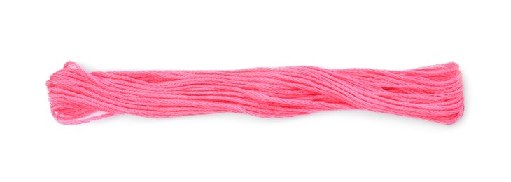 Bright pink embroidery thread on white background