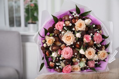 Beautiful food bouquet on wooden table indoors, space for text