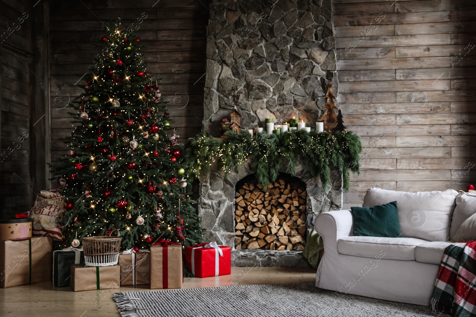 Photo of Festive interior with decorated Christmas tree and fireplace