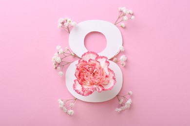 Photo of Paper number 8 and beautiful flowers on pink background, top view