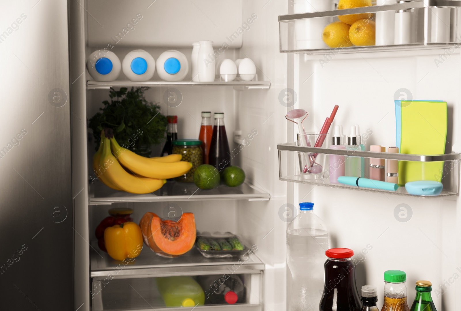 Photo of Storage of cosmetics in refrigerator door bin next to groceries