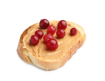 Slice of bread with peanut butter and cranberries on white background