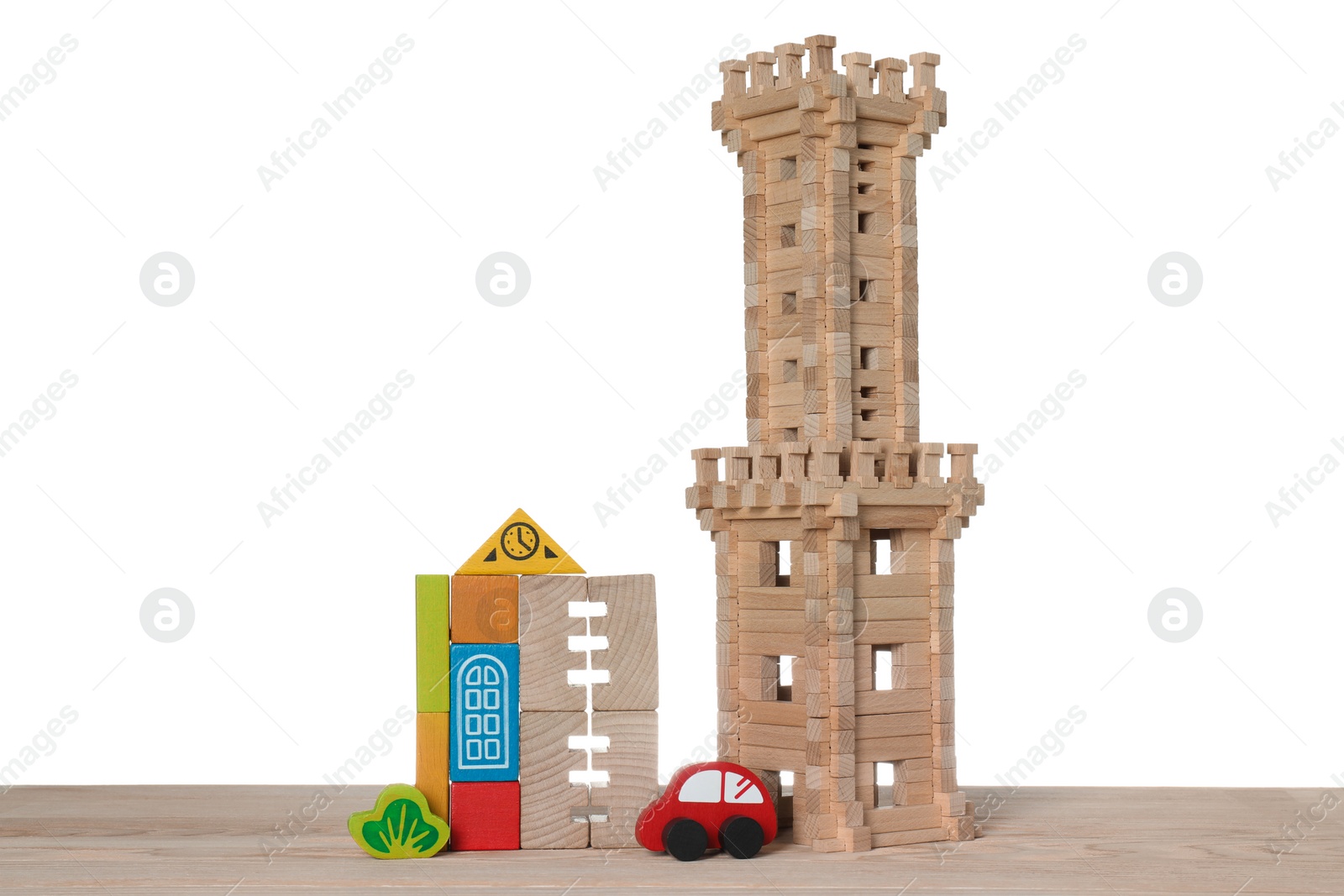 Photo of Set of toys on wooden table against white background. Children's development