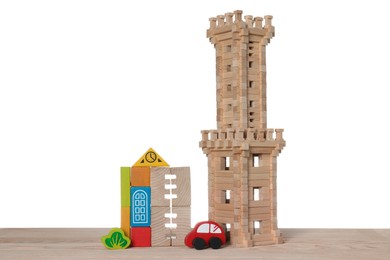 Set of toys on wooden table against white background. Children's development