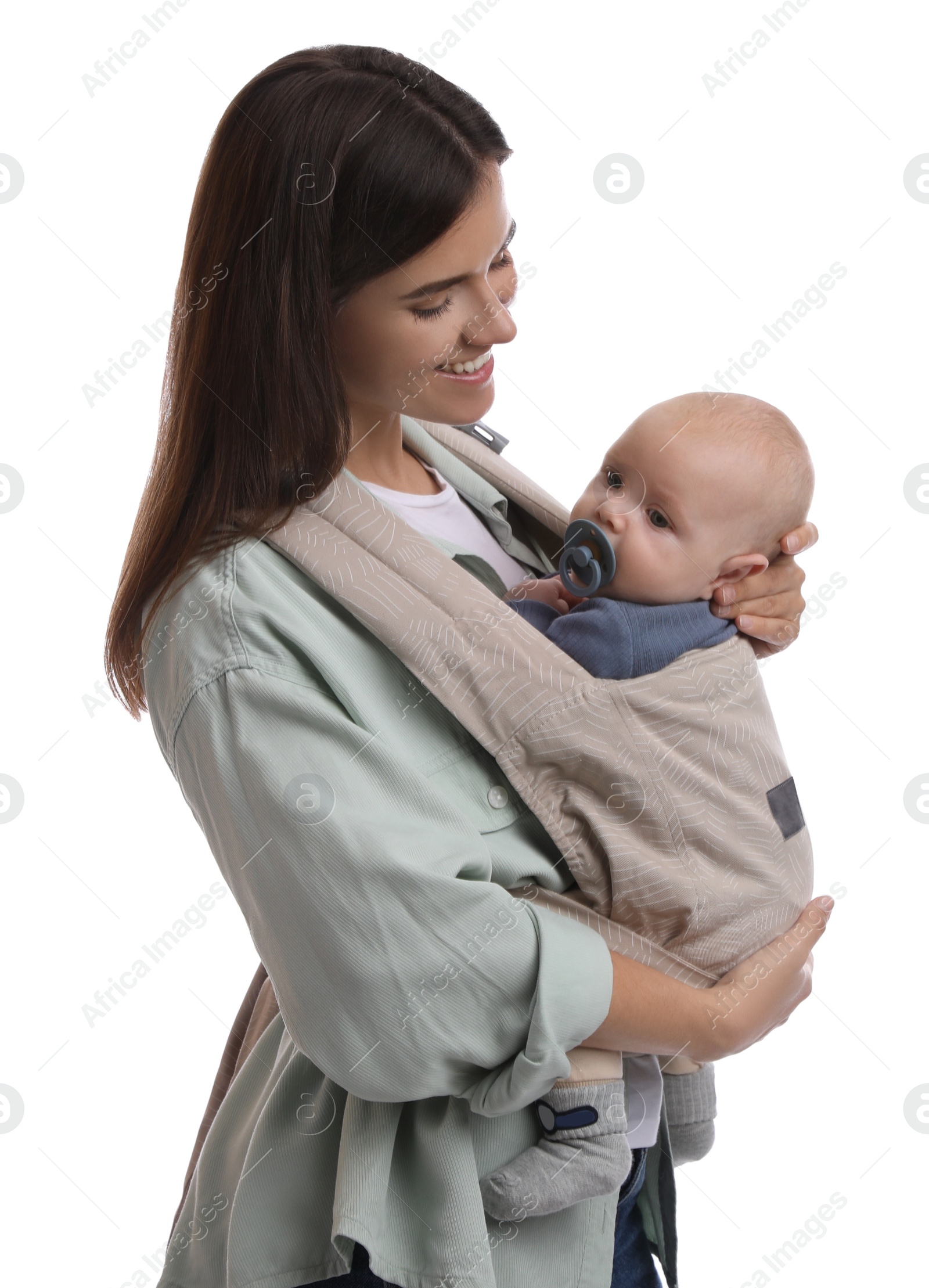 Photo of Mother holding her child in baby carrier on white background