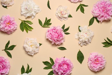 Photo of Flat lay composition with beautiful peony flowers on beige background