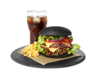Photo of Slate plate with black burger and French fries at glass of cola isolated on white