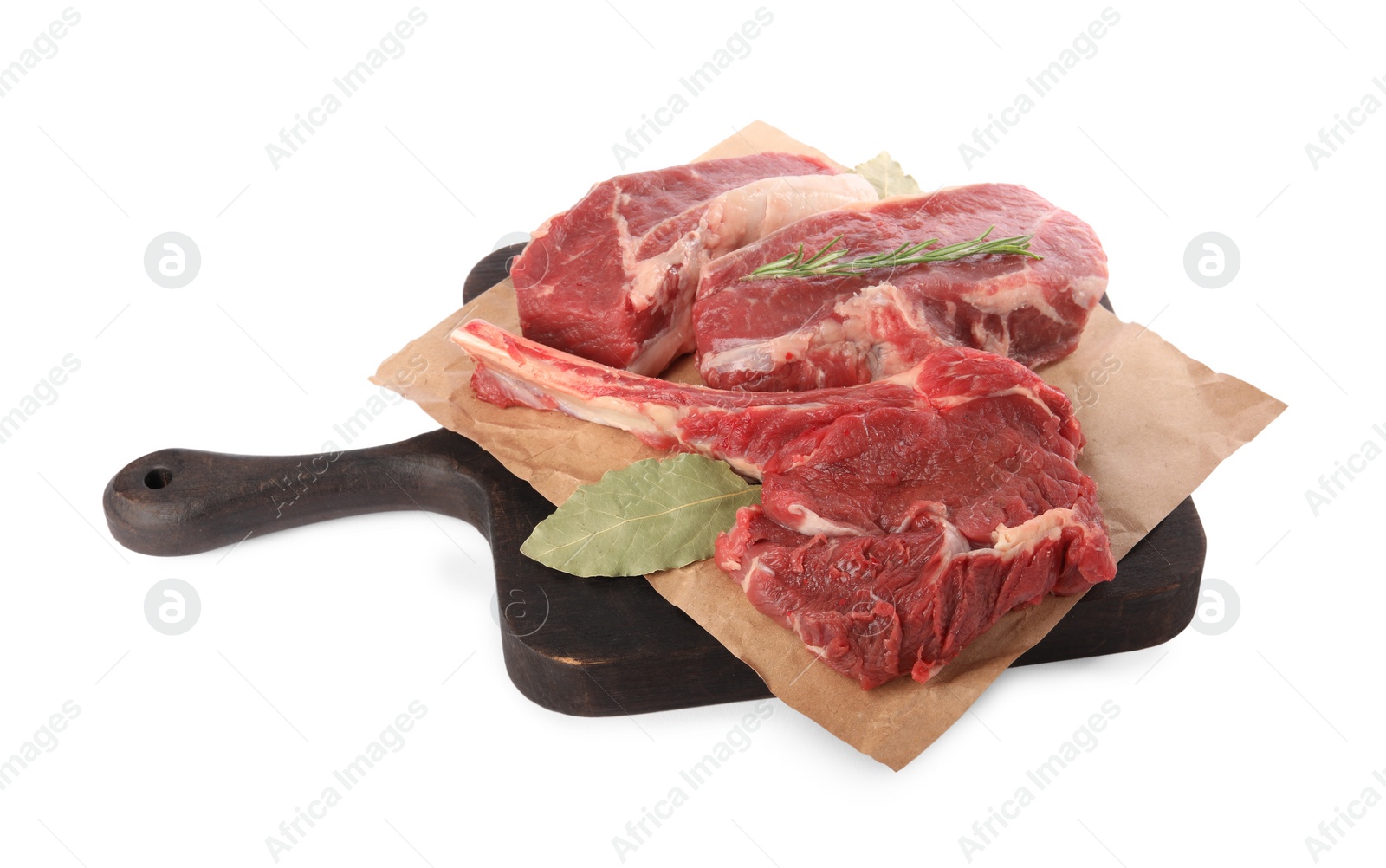 Photo of Board with pieces of raw beef meat and spices isolated on white