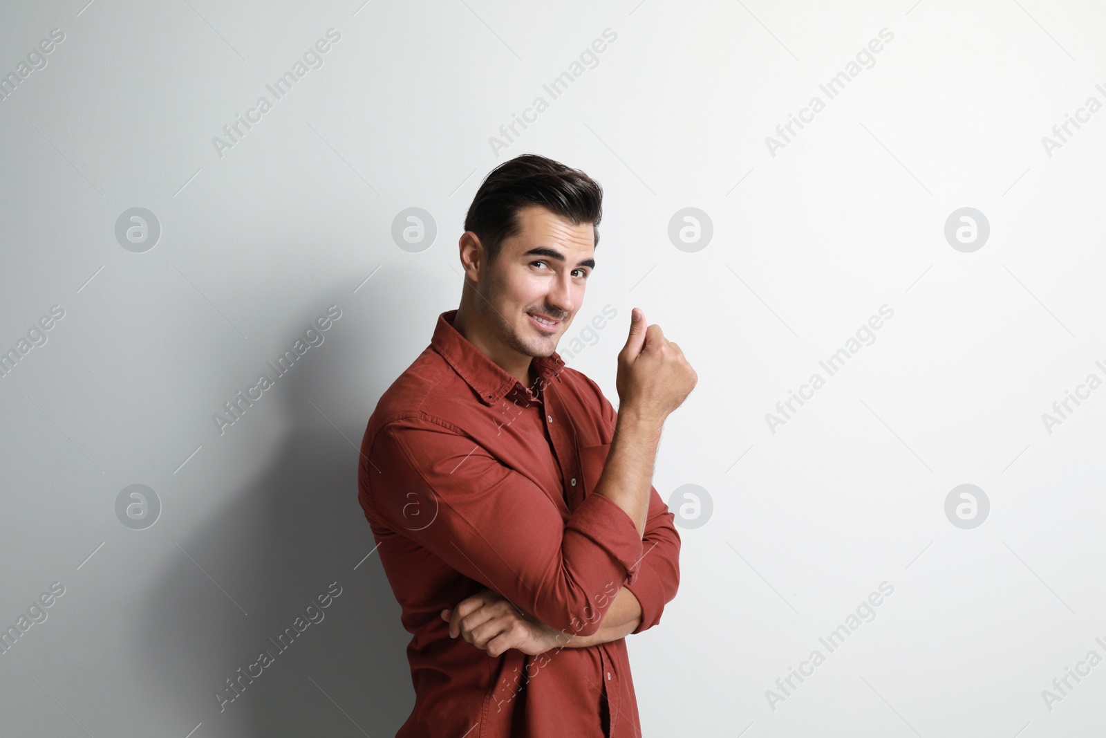 Photo of Portrait of handsome young man on white background