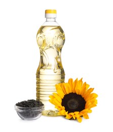 Sunflower cooking oil, seeds and yellow flower on white background