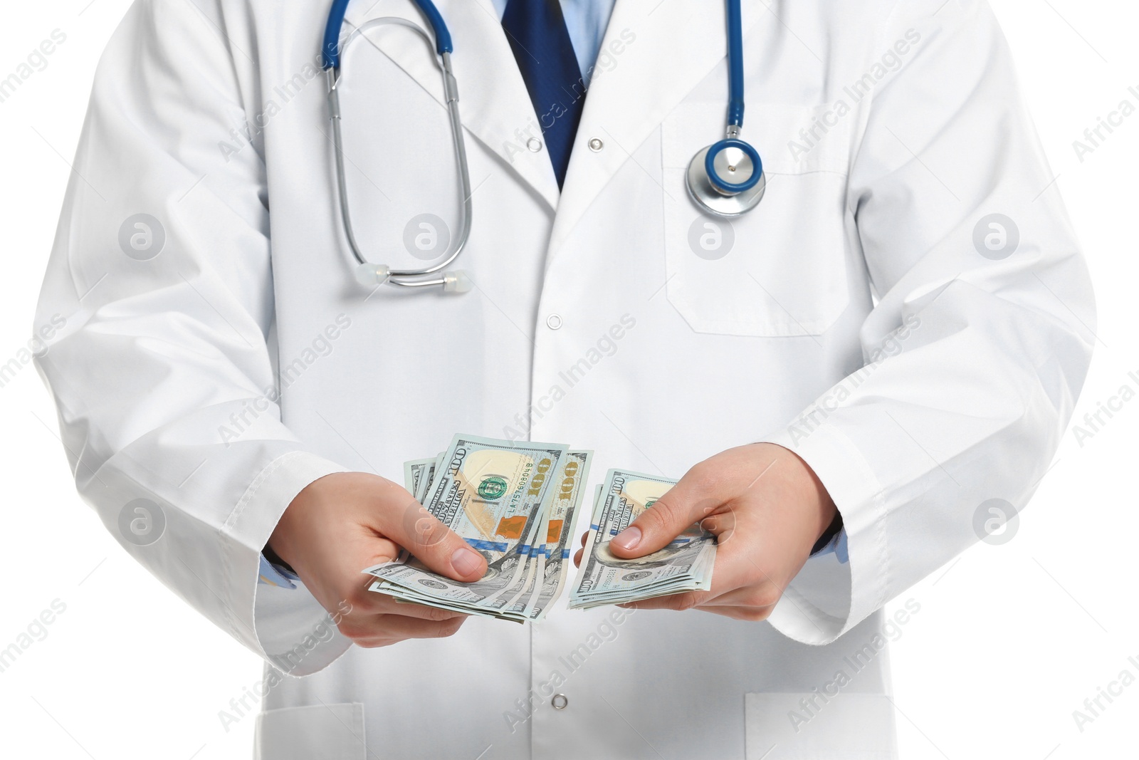 Photo of Doctor with bribe on white background, closeup. Corruption in medicine