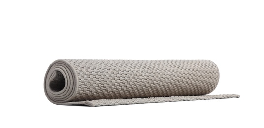 Photo of Rolled grey carpet on white background. Interior element