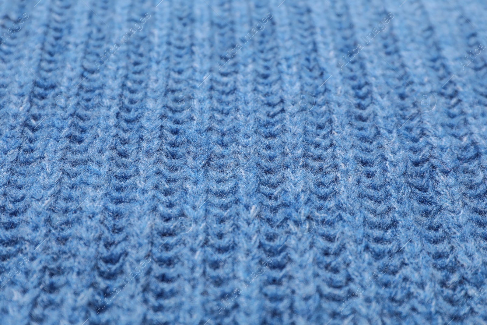 Photo of Surface of winter clothing as background, closeup