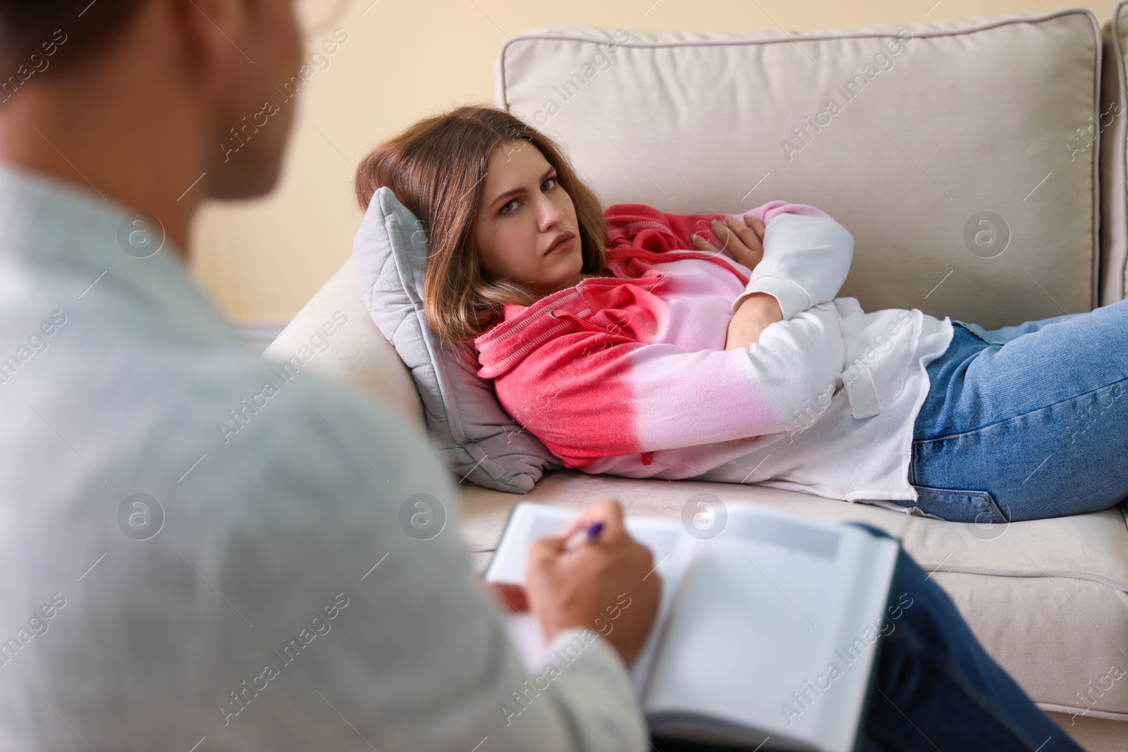 Photo of Professional psychotherapist working with patient in office