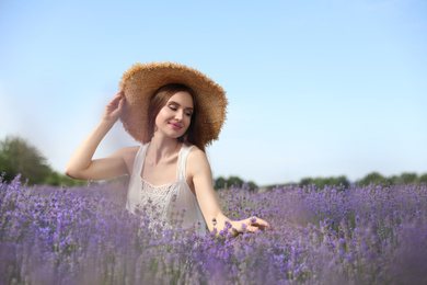 Young woman in lavender field on summer day