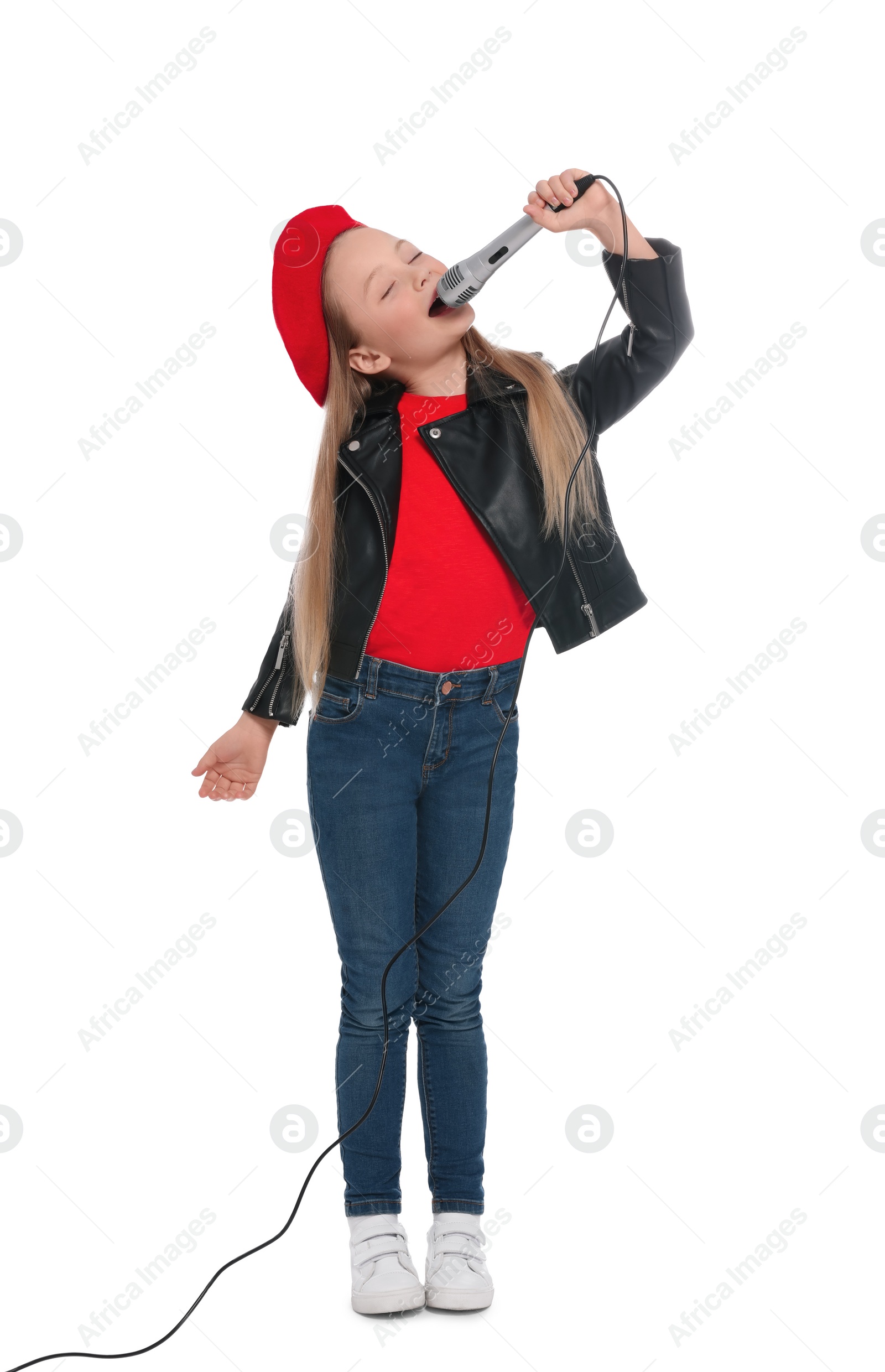 Photo of Cute little girl with microphone singing on white background