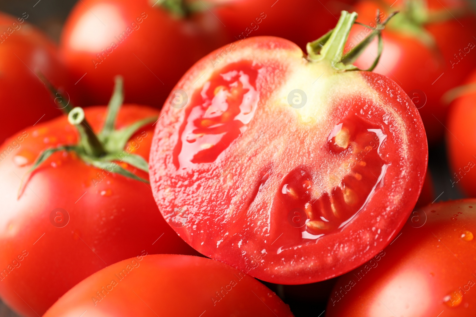 Photo of Pile of fresh ripe tomatoes, closeup view