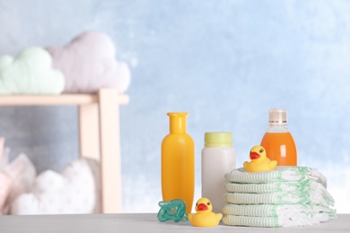 Photo of Set with baby accessories on table indoors, space for text