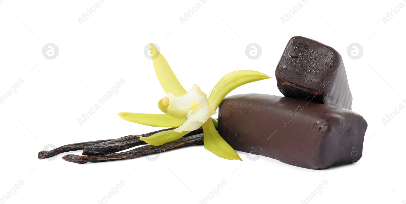 Photo of Glazed curd cheese bars, vanilla pods and flower isolated on white