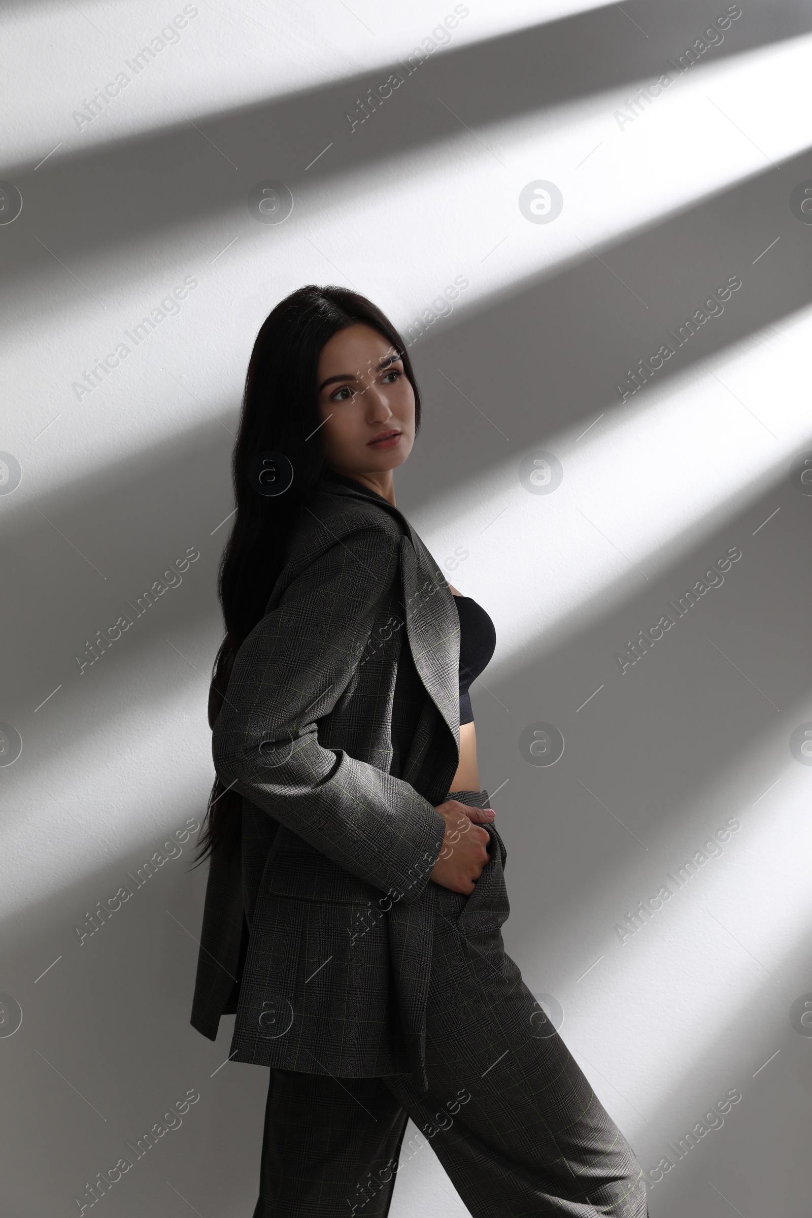 Photo of Beautiful woman in formal suit on white background. Business attire