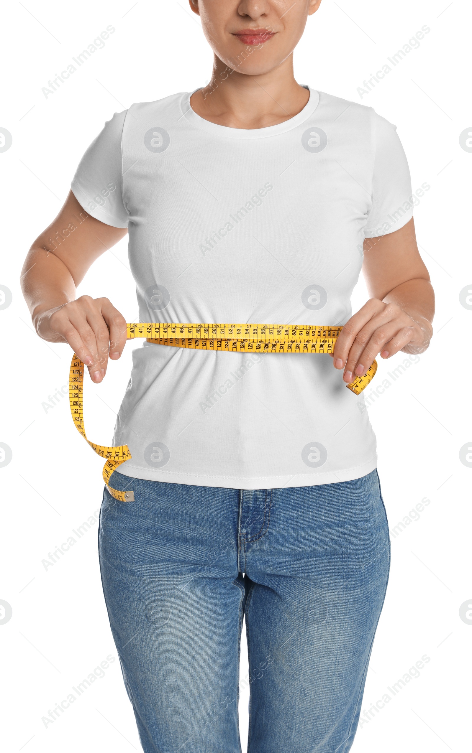 Photo of Woman measuring waist with tape on white background, closeup