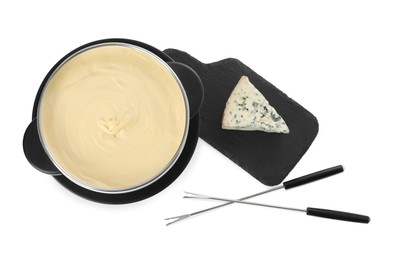 Fondue with tasty melted cheese, forks and piece isolated on white, top view