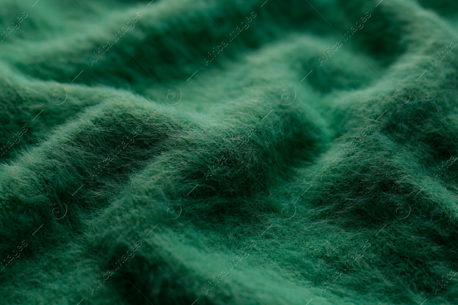 Photo of Beautiful green fabric as background, closeup view