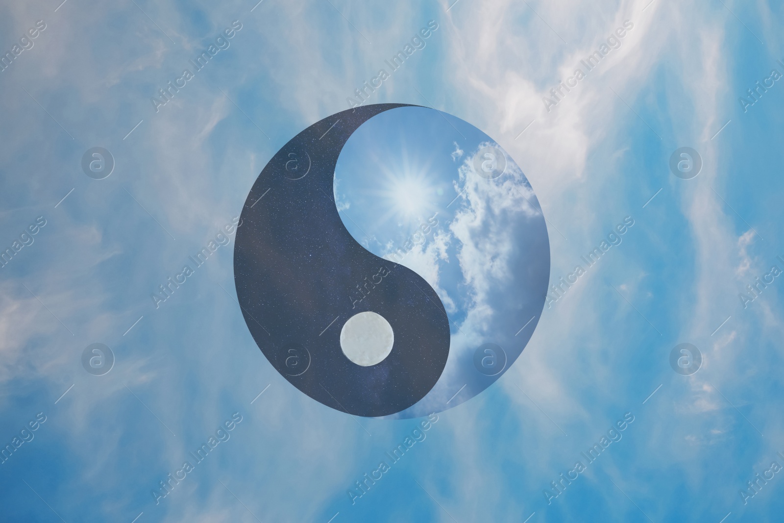 Image of Ying Yang symbol against blue sky. Feng Shui philosophy