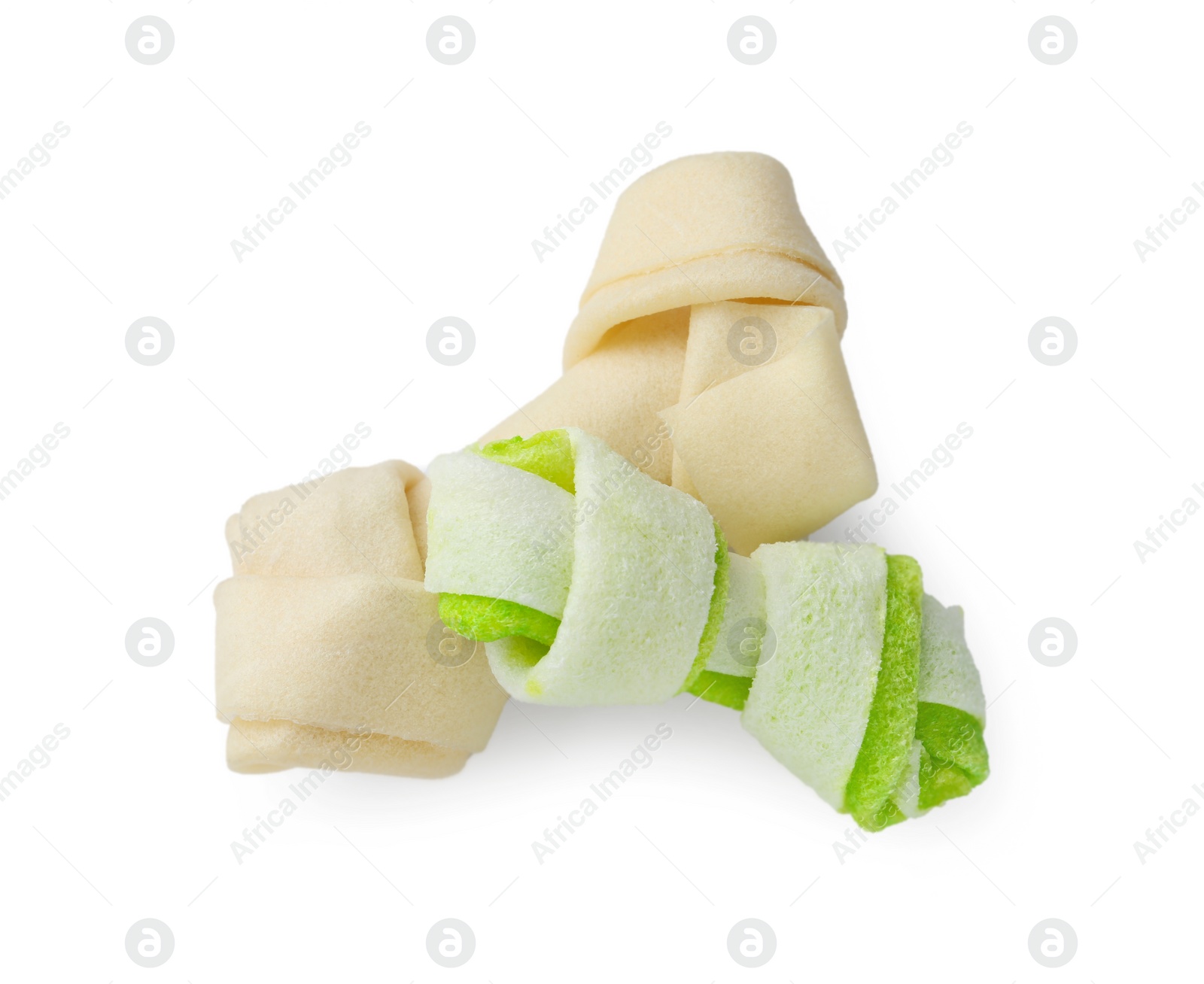 Photo of Chew bones for dog isolated on white, top view. Pet toys