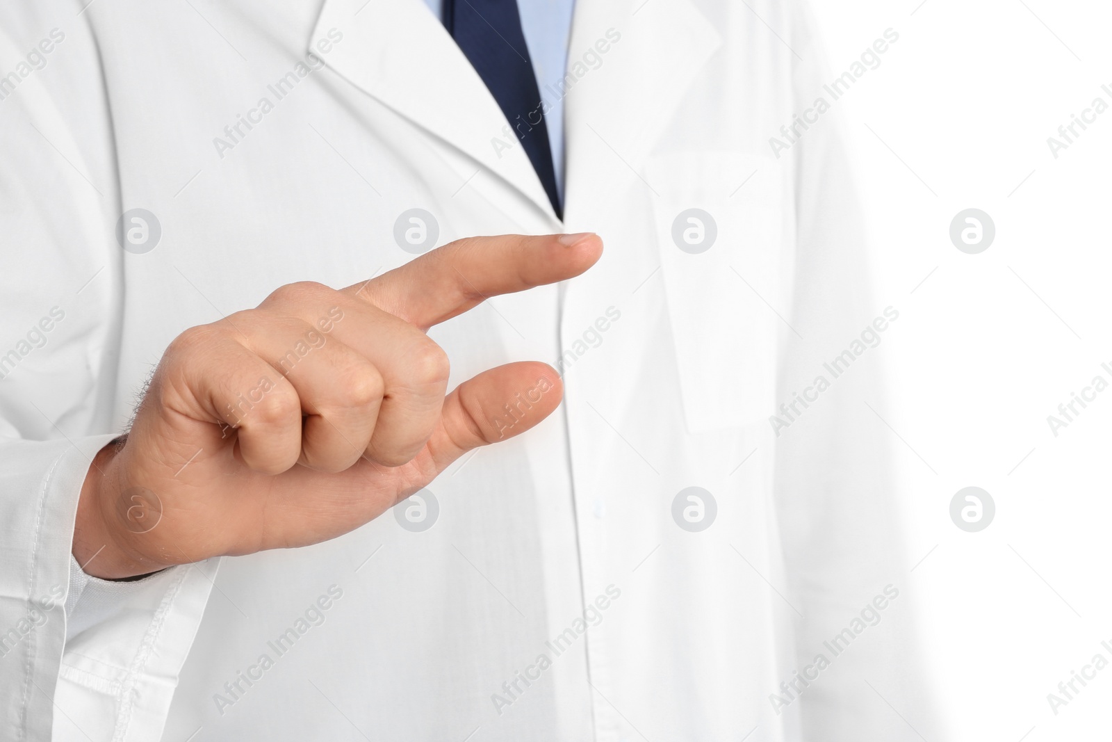 Photo of Male doctor pointing on white background, closeup