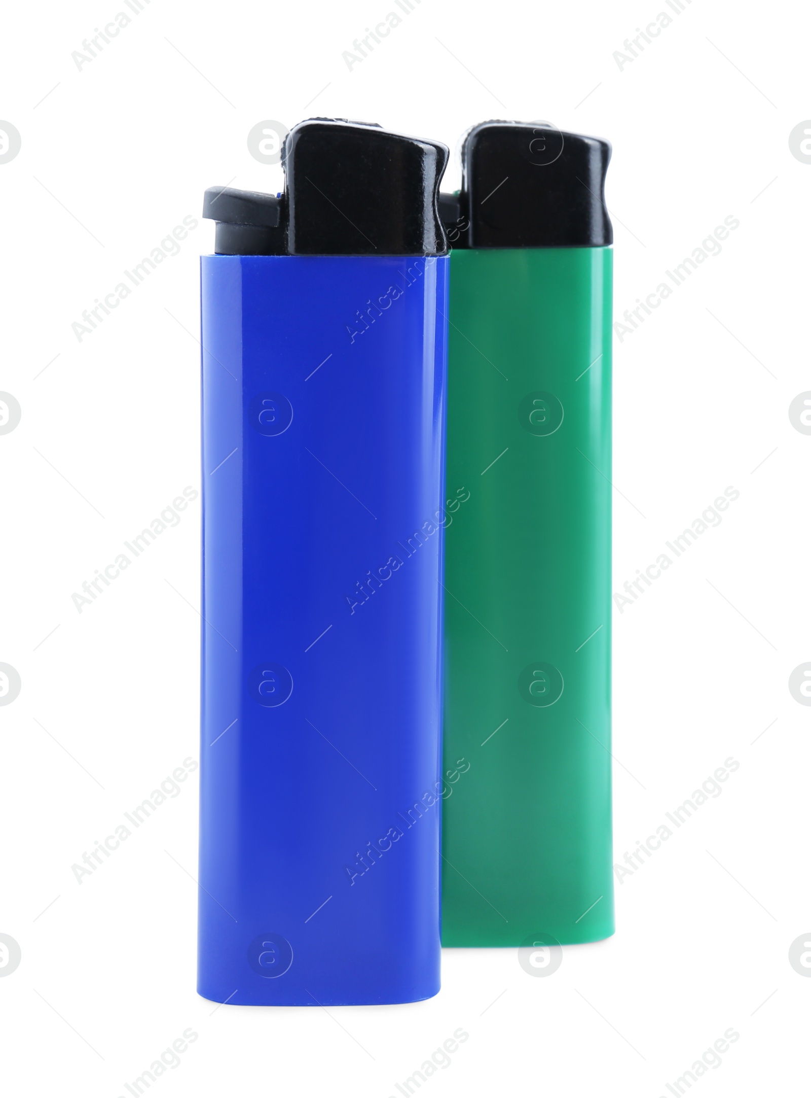 Photo of Stylish small pocket lighters on white background