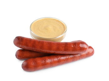 Photo of Delicious grilled sausages and sauce on white background. Barbecue food