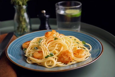 Delicious pasta with shrimps on plate