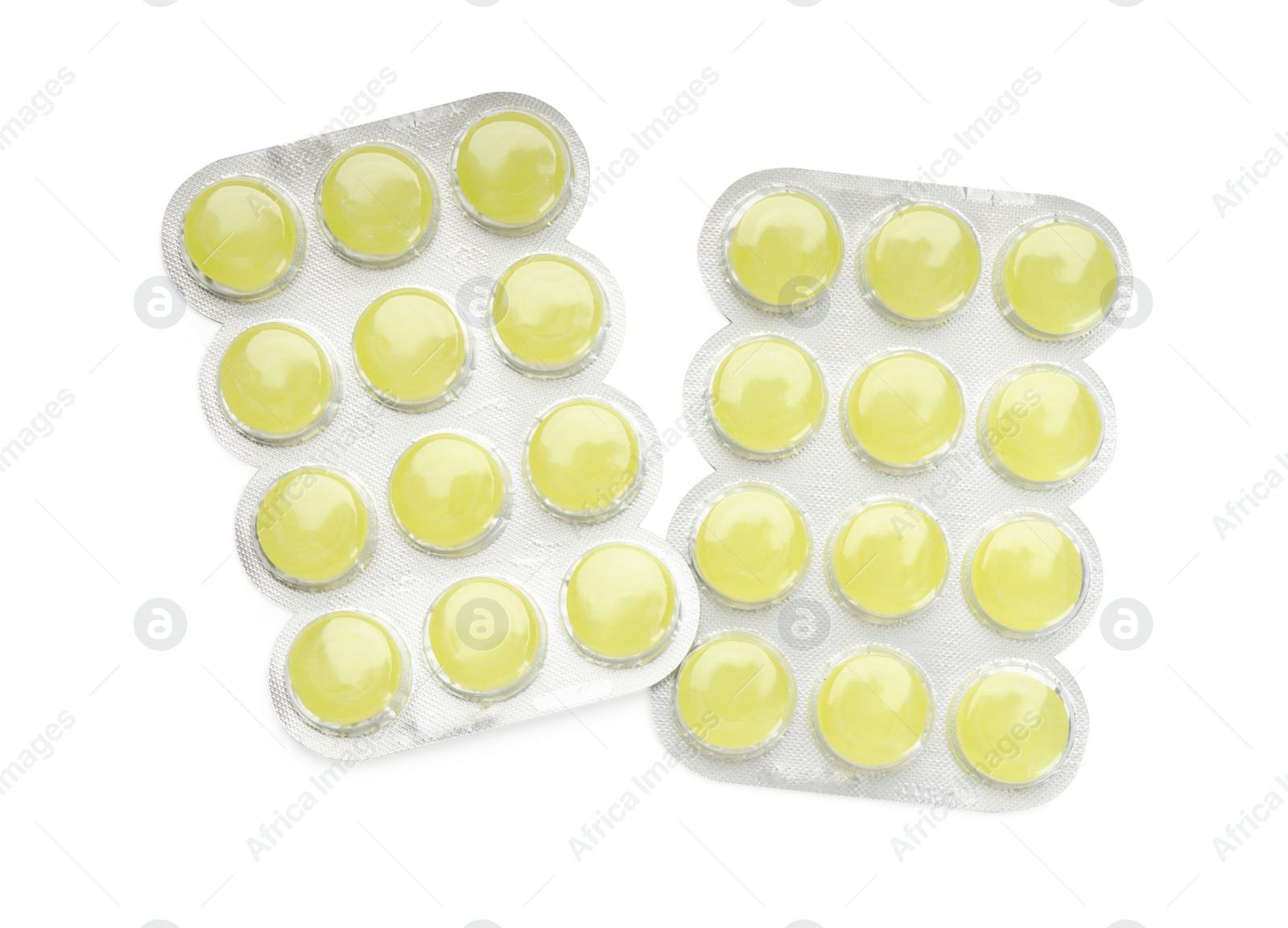 Photo of Blisters with yellow cough drops on white background, top view
