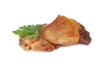 Photo of Tasty fried cracklings with parsley on white background. Cooked pork lard