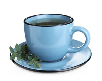 Photo of Cup of green tea with eucalyptus leaves on white background