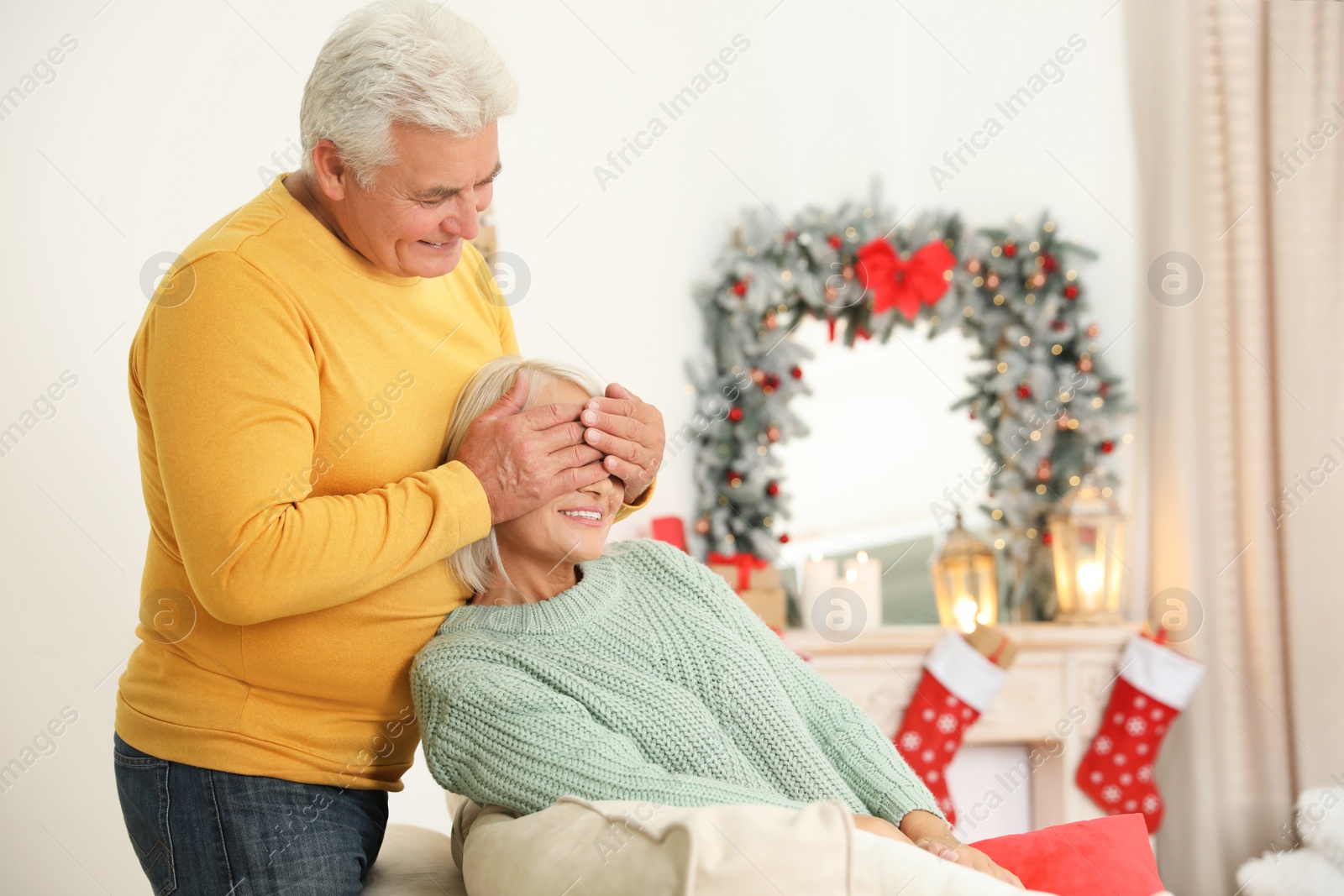 Photo of Happy mature couple at home. Christmas celebration