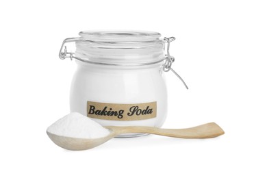 Spoon and jar with baking soda on white background