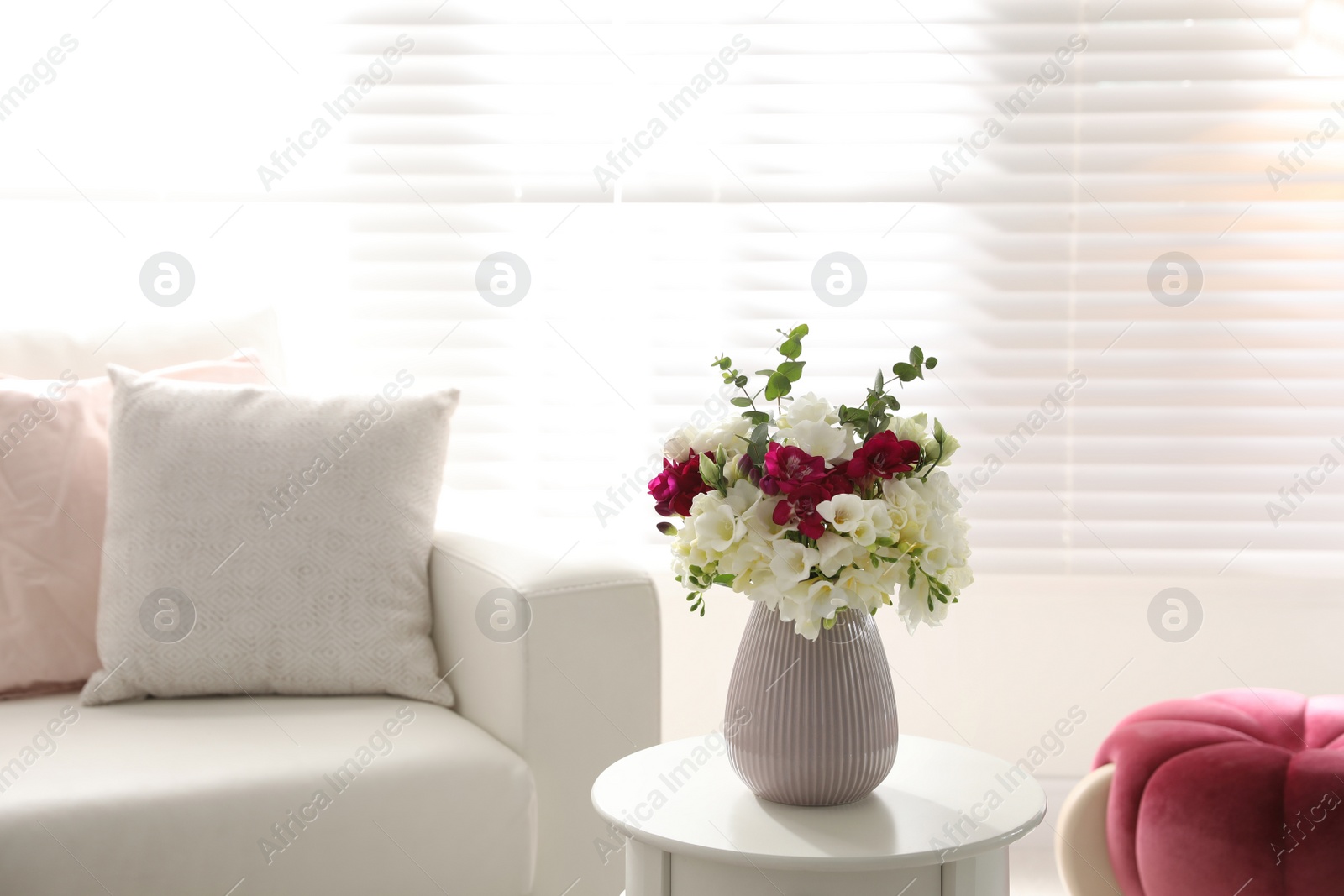 Photo of Beautiful bouquet with spring freesia flowers in light room