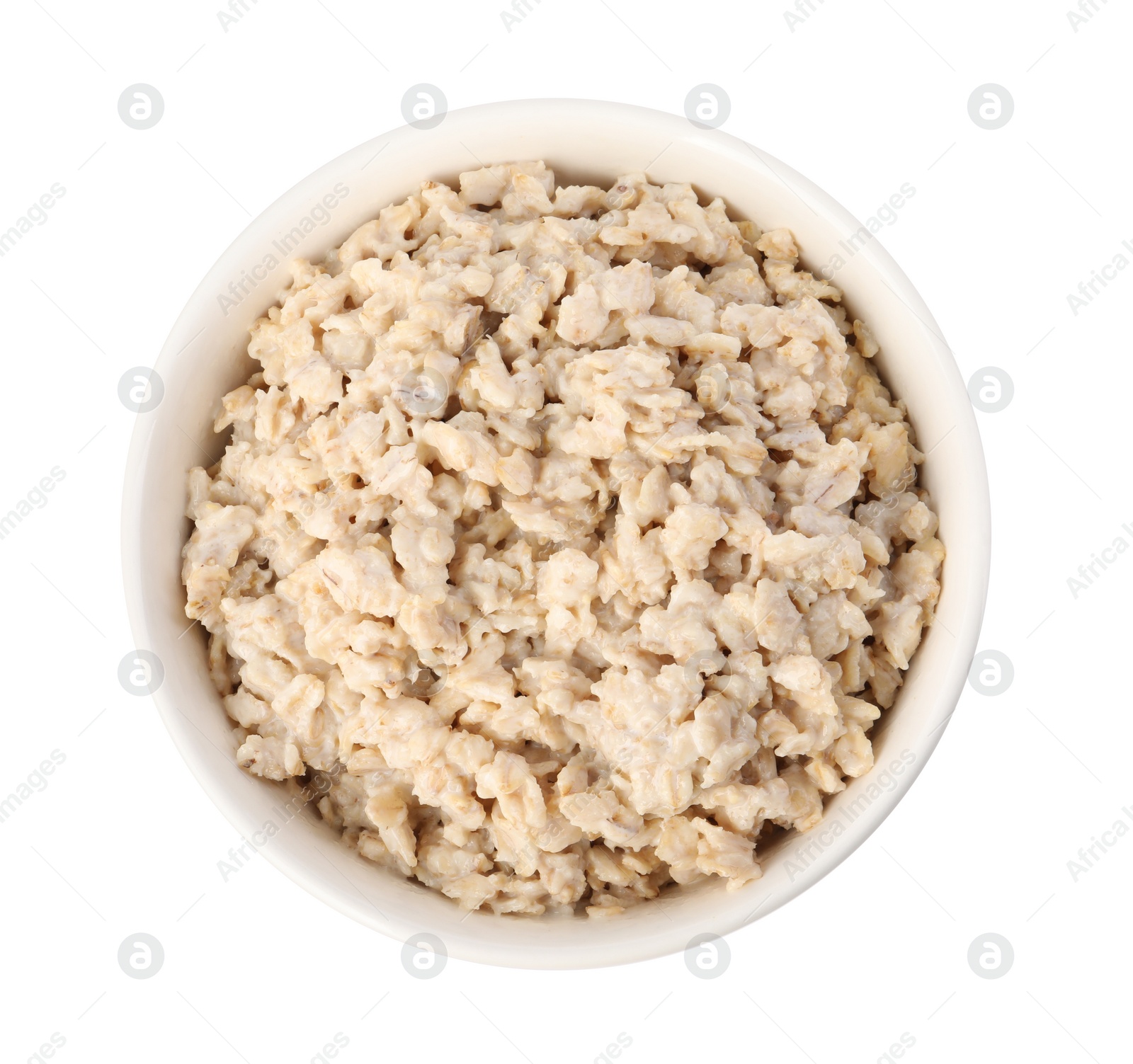 Photo of Tasty boiled oatmeal in bowl isolated on white, top view