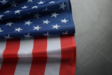 Photo of Flag of USA on light grey table, closeup