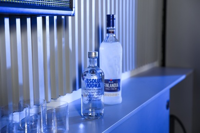 MYKOLAIV, UKRAINE - SEPTEMBER 23, 2019: Bottles of Finlandia and Absolut vodka on bar counter