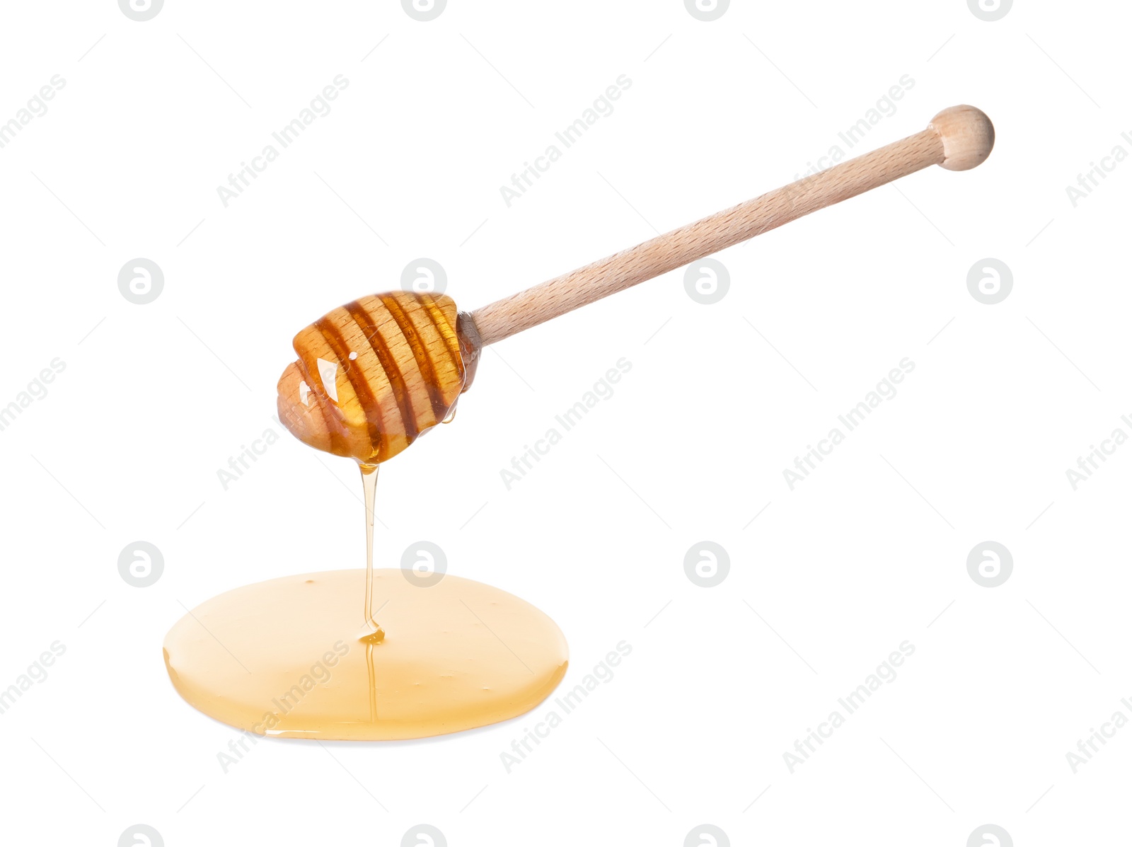 Photo of Fresh honey dripping from dipper on white background