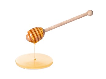 Fresh honey dripping from dipper on white background