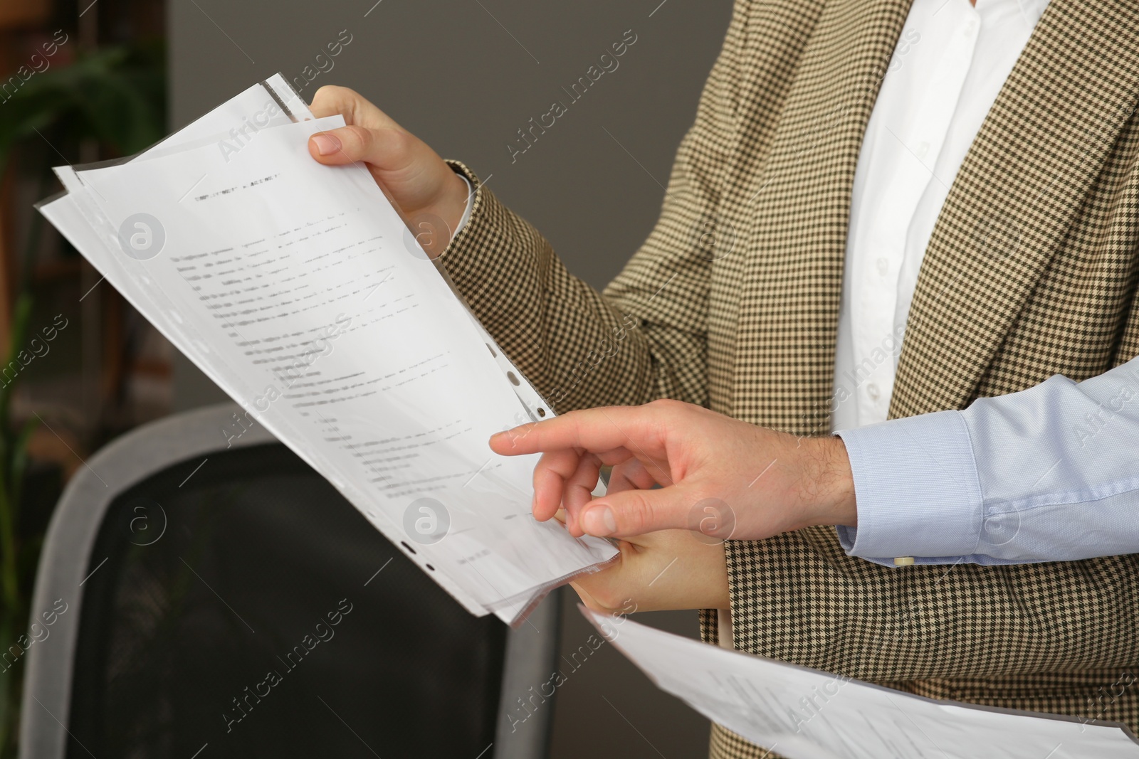 Photo of Businesspeople working with documents in office, closeup