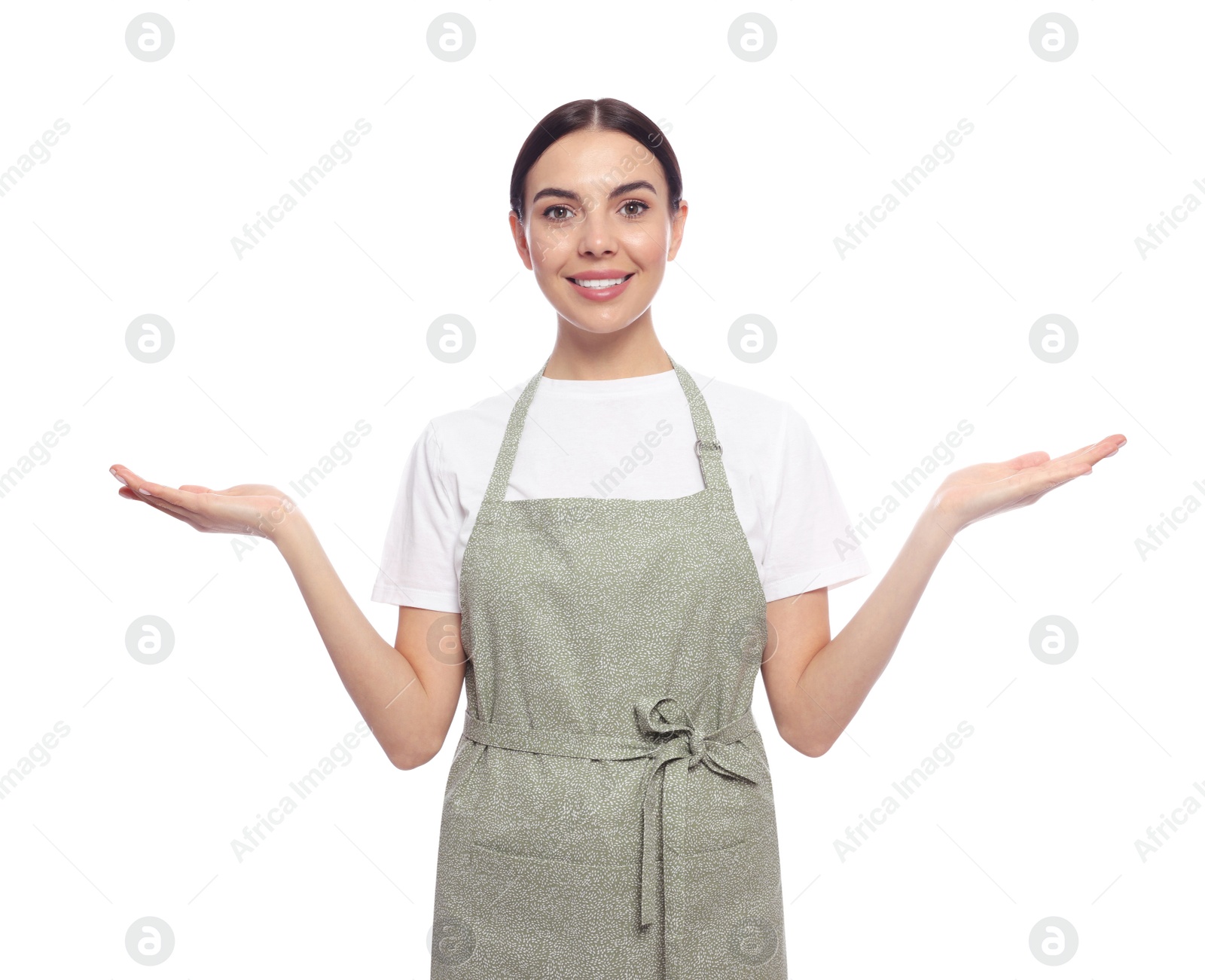 Photo of Young woman in light green apron on white background